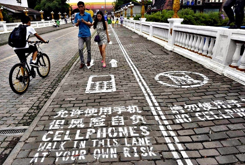 A designated 'Cellphone Sidewalk' in Chongqing, China. Photo credit: China Daily/Reuters