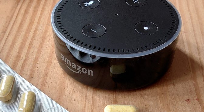 Amazon Alexa next to some medication